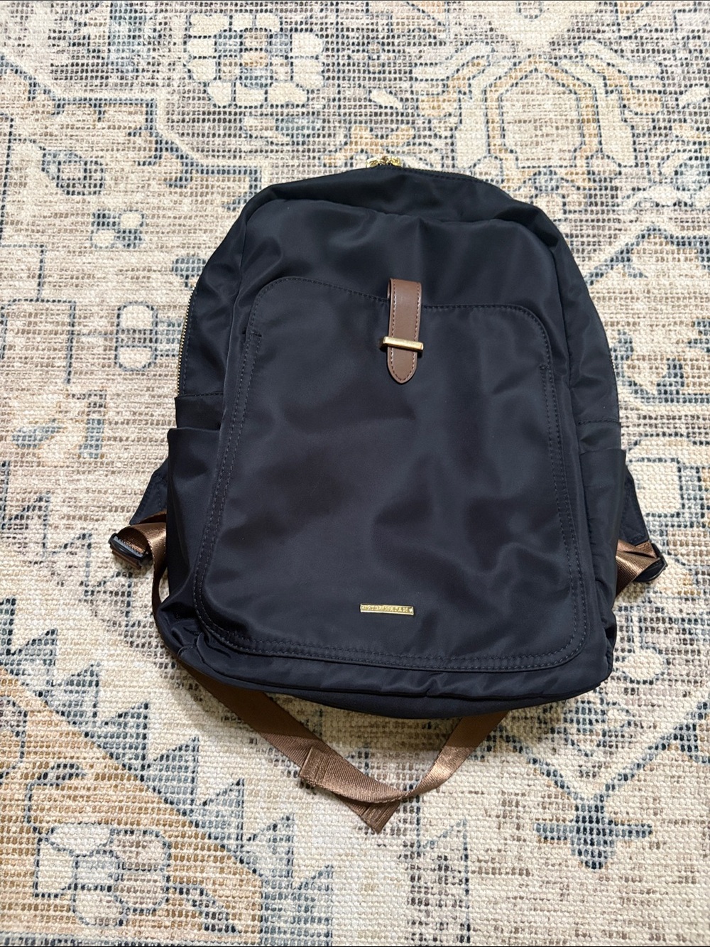 Golf madam nylon backpack with trolley sleeve.